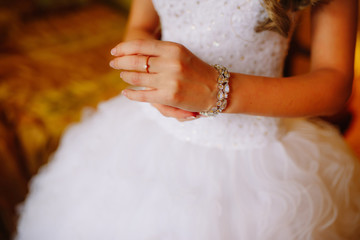 The bride is wearing a bracelet