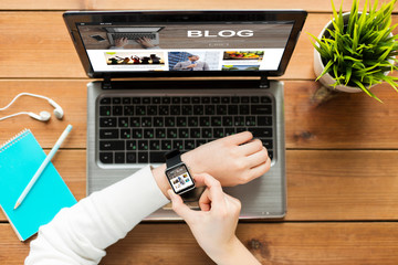 close up of woman with smart watch and laptop