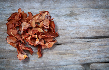 Garcinia cambogia fresh fruit on wood background.  Fruit for die