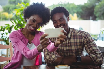 Young couple taking selfie
