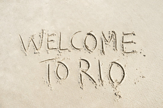 Welcome to Rio (as in, de Janeiro, Brazil) message handwritten in smooth sand on the beach in Ipanema