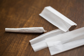 close up of marijuana joint and cigarette paper
