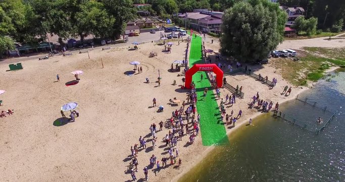 Aerial Shot: Fly Over Triathlon Swimming Stage 