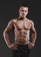 Fototapeta na wymiar Healthy muscular young man. Sport portrait.