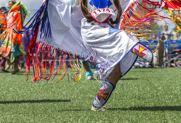 Close up of legs kicking it at powwow.