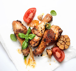 fried chicken legs on a culinary paper. 