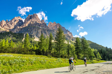Fototapeta na wymiar Bike on the road with mountain view in Dolomites, Italy