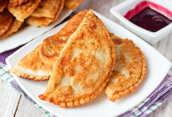 Caucasian cuisine - Cheburek pie with meat and pomegranate sauce