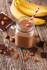 Detox chocolate smoothie with nuts in glass jar.