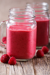Tasty raspberry smoothie on table.