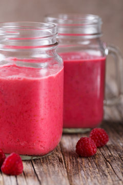 Tasty raspberry smoothie on table.