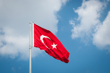 Turkish flag waving in blue sky