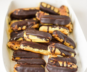 chocolate eclairs on white box