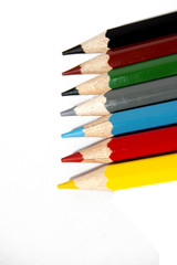 Colored pencils on white background