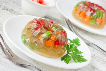 Meat galantine with vegetables, beautiful decoration aspic