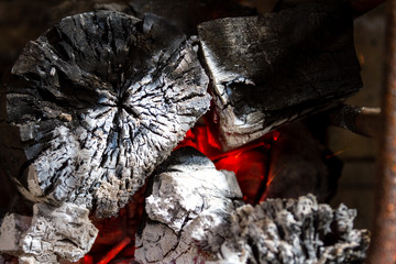 red hot wood embers detail in fire place