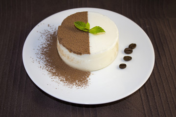 Panna cotta with chocolate chips, mint and coffe