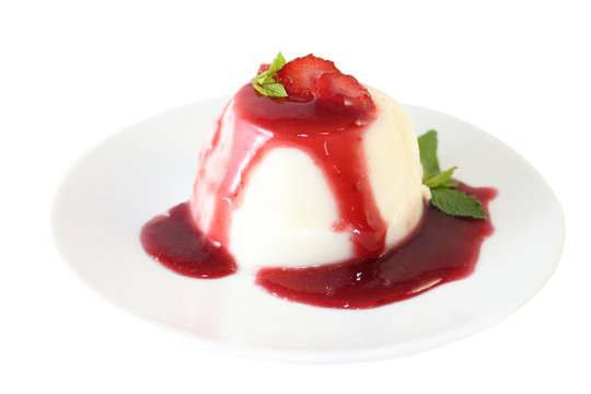 Panna cotta on plate with strawberry jam