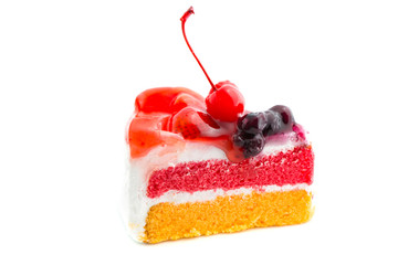 a colorful cake decorated with a cherry on the top