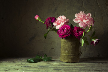 Red rose on wooden table