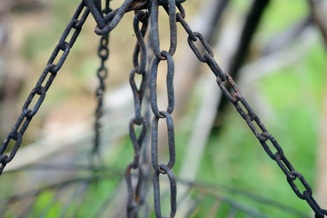 Old, black, rusty  iron chains