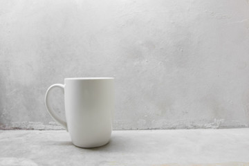 White coffee mug on concrete table