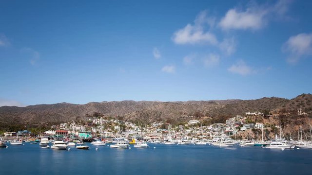 Looking down at the bay and town of Avalon on Catalina Island. Boat fill the harbor. Time Lapse