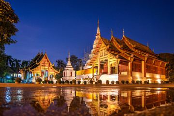 Beautiful Wat Phra Sing temple,Reflection in standing water  Chi