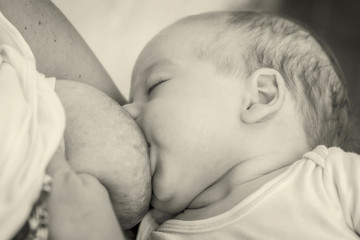 Close Up Of Mother Breast Feeding Her Newborn Baby Boy