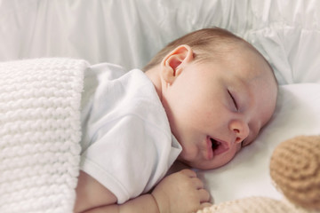 Baby Boy Sleeping On The Blanket