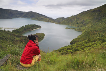Tourist resting in Volcanic Lake lagoa do fogo, Sao Miguel Azore