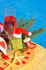 Christmas decoration and Glasses with red champagne.