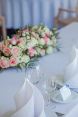 Glasses on restaurant. table appointments. wedding, floral decor