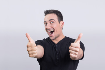 Happy man holding his thumbs up 