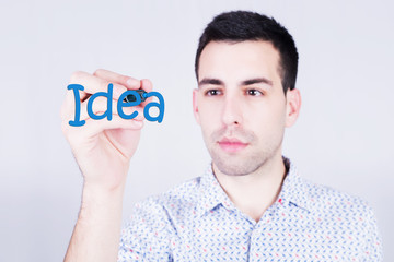 Man writing an Idea word 