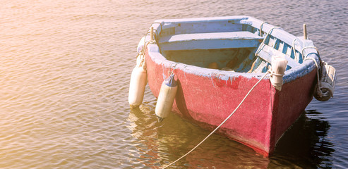 LIttle boat adrift on the water