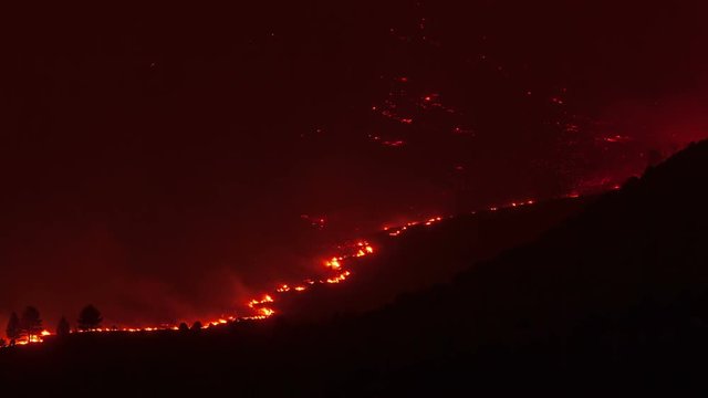 Forest fire burning a mountainside in California.