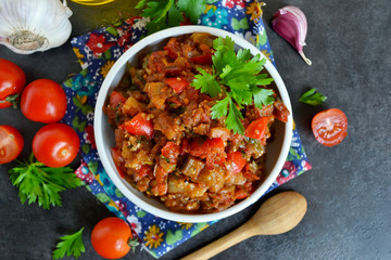 vegetable stew of eggplant on a black background, grilled vegeta