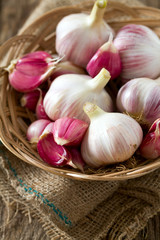 fresh garlic on wooden surface