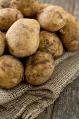 potatoes on wooden surface