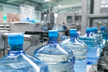 Water factory - Water bottling line for processing and bottling pure spring water into gallons.