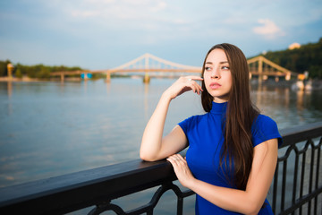 Portrait of pretty thoughtful young brunette
