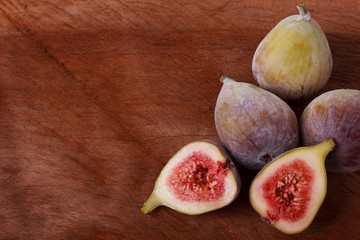 Fresh figs on wooden table