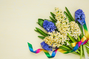 Bouquet of spring hyacinths decorated with ribbon. Top view, copy space 