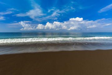 Fototapeta premium Black volcanic sand beach in Bali Island Indonesia