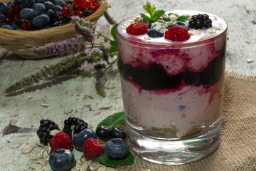 diet berry jogurt dessert with oat flakes and mint