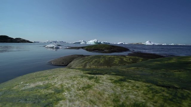 Icebergs are moving on the arctic ocean, its short film of glaciers.