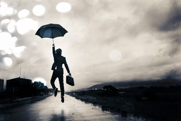 傘を差してジャンプするビジネスマン - obrazy, fototapety, plakaty