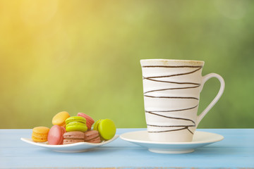 Stock Photo:.White mug on wooden table over grunge background