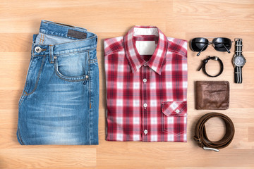 Men's casual outfits with accessories on wooden table top view